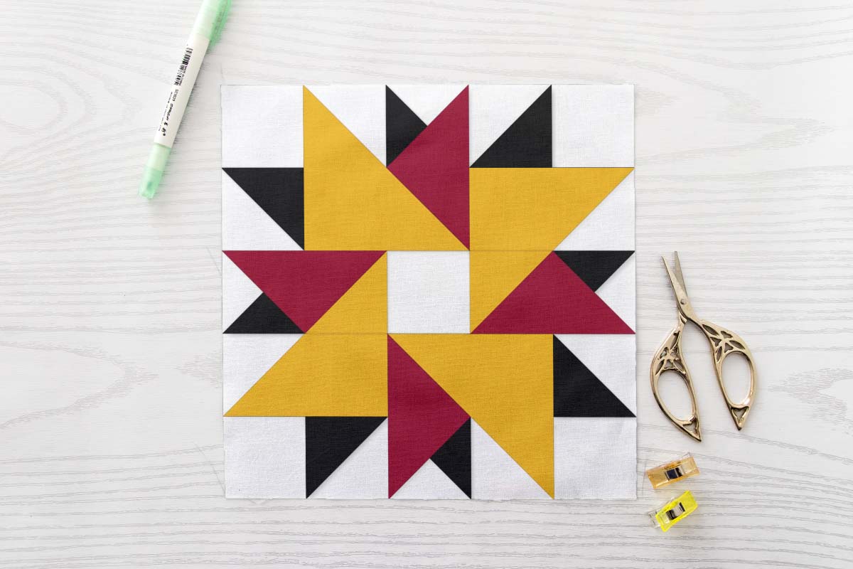 Easy Double Pinwheel Star FPP Quilt Block Pattern - Four Colour Scrap Friendly Spinning Star Quilt Block in Yellow Crimson Black and White