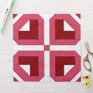 Four Petal Heart FPP Quilt Block Pattern PDF - Pink and Red Floral Quilt Block with Four Heart Shaped Petals on White Background