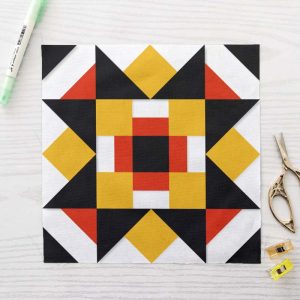 Framed Sawtooth Star FPP Quilt Block Pattern PDF - Bold Black Orange and Yellow Sawtooth Star Quilt Block with Framed Cross Centre